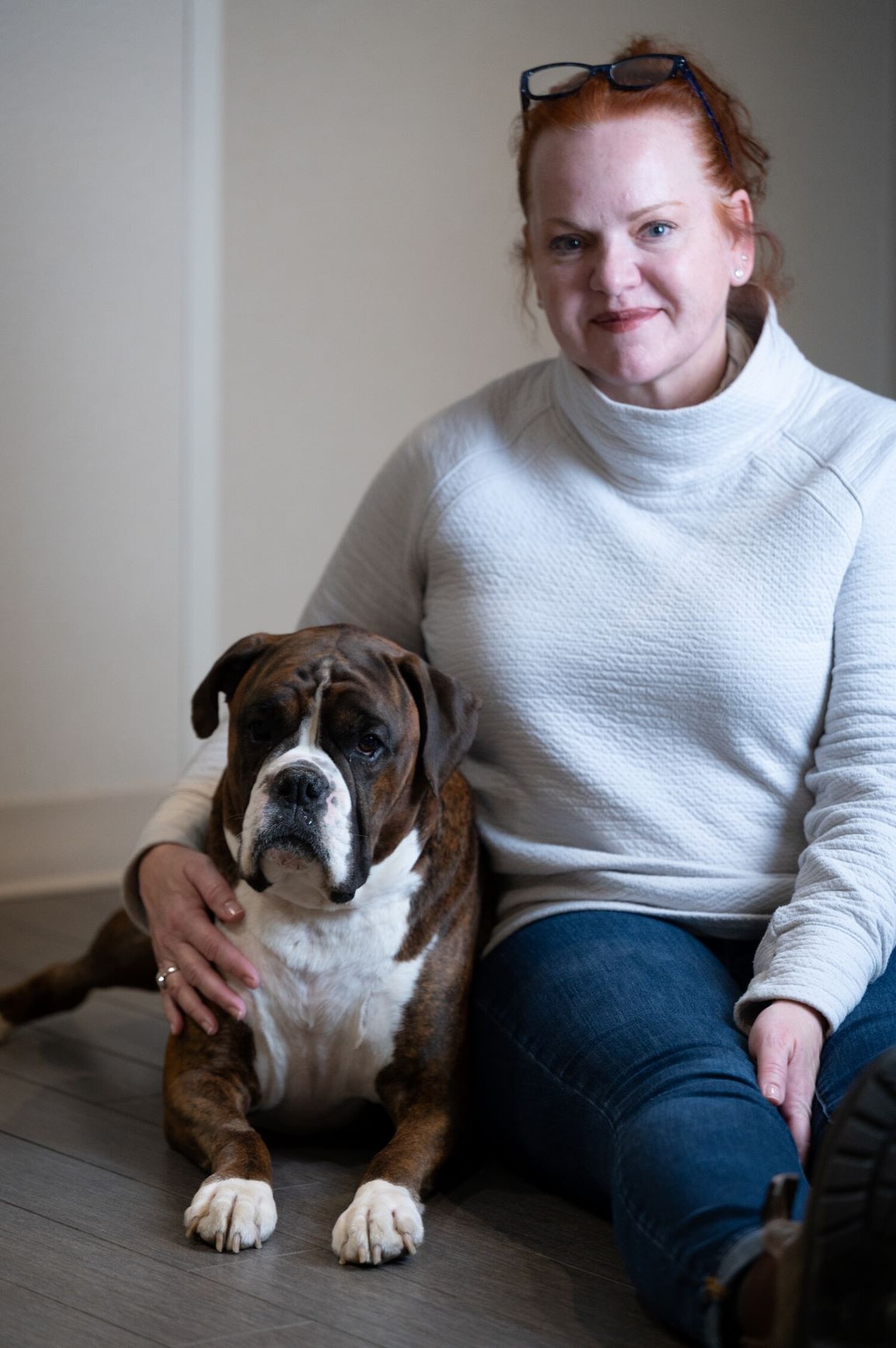 Robyn Porter sits with her dog, Huck