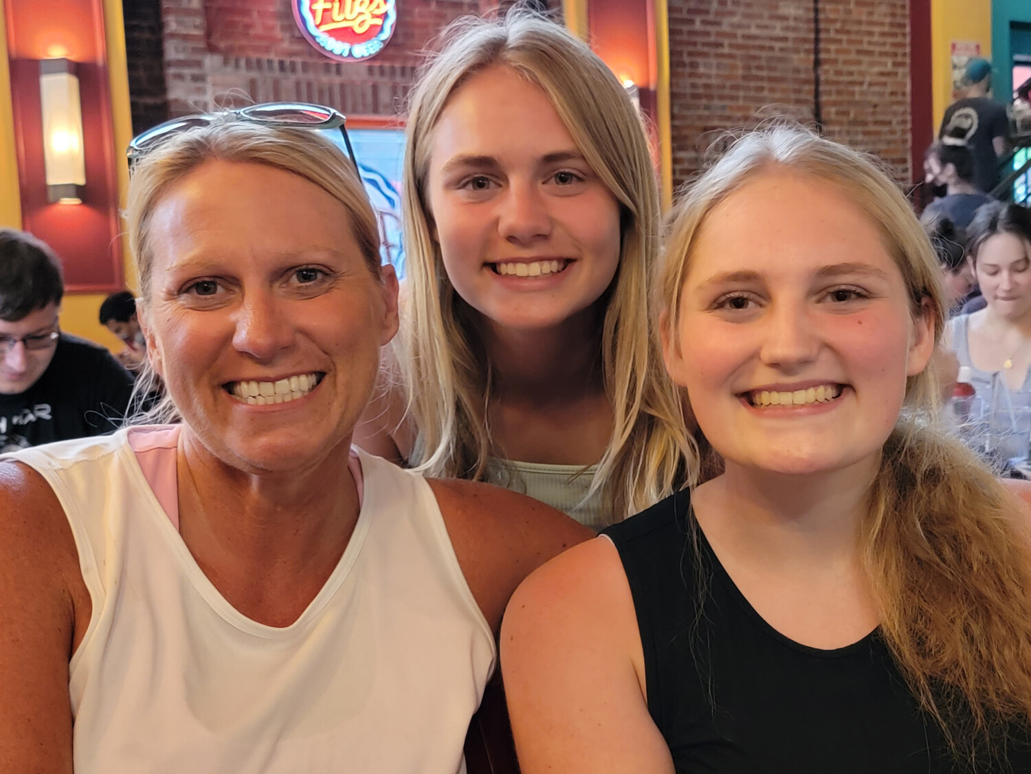 Sarah Wittenberg poses for a photo with her two daughters